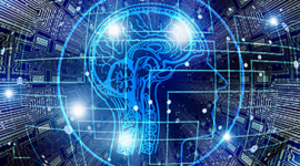Imagem. Cabeça de um homem com contorno azul e com o desenho do cérebro. A cabeça está rodeada por um círculo azul e atrás um fundo que remete a computação.