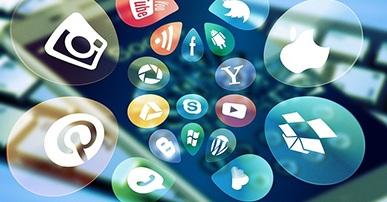 Imagem: ícones das redes sociais saindo de uma tela de celular dentro de bolhas.
